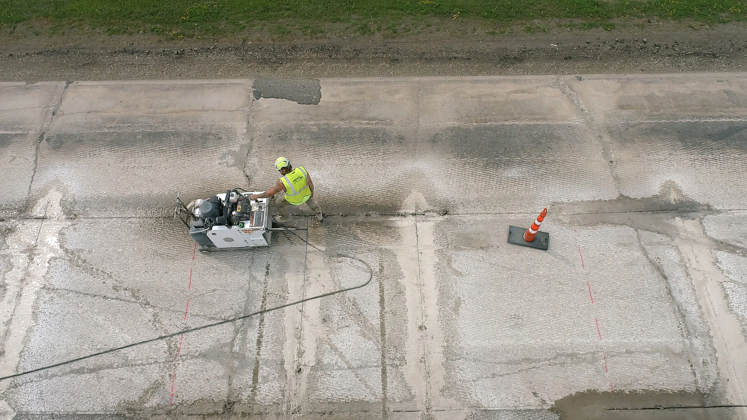 man pushing concrete saw